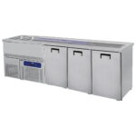 Serving counter with 2 bowls left and 3 doors for kegs of 50 litres